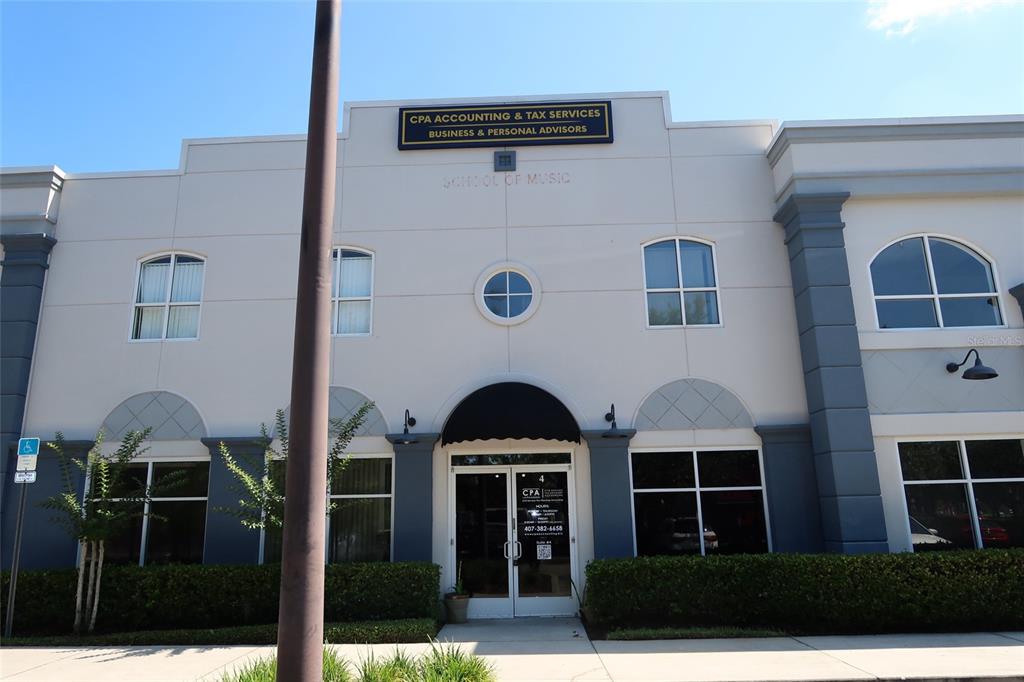 The exterior of a two-story commercial building features a CPA office with a prominent sign — 448 S ALAFAYA TRAIL UNIT 4, ORLANDO, FL