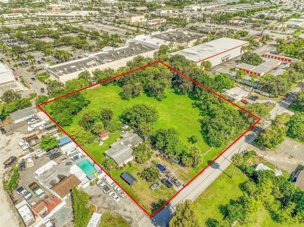 An aerial view shows a large, rectangular grassy lot outlined in red with a house — 1865 Donnell Road, West Palm Beach FL 33409, WEST PALM BEACH, FL