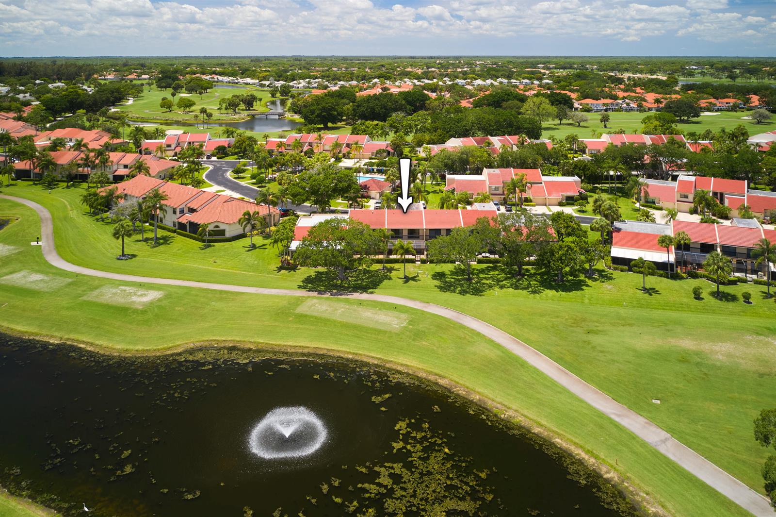 An aerial view shows a multi-story residential building with red roofs overlooking a golf course — 832 Windermere Way, Palm Beach Gardens FL 33418, PALM BEACH GARDENS, FL