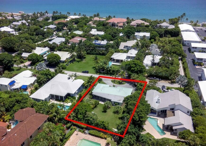 An aerial view shows a single-story house with a light green roof outlined in red — 5550 Osprey Drive, Ocean Ridge FL 33435, OCEAN RIDGE, FL