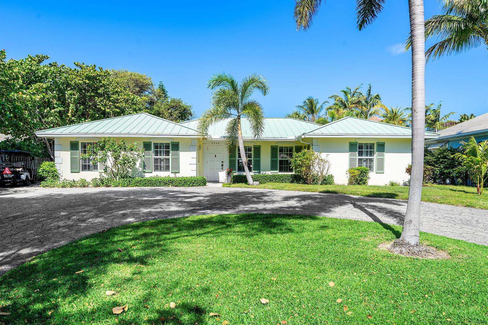 A single-story house with a green metal roof and a circular driveway — 5550 Osprey Drive, Ocean Ridge FL 33435, OCEAN RIDGE, FL