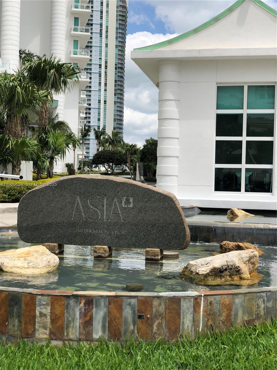 A stone sign for Asia stands in front of a water feature and tall buildings — 900 Brickell Key Blvd # 1602, Miami FL 33131, MIAMI, FL