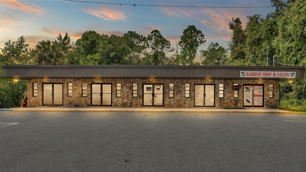 A single-story commercial building with a stone facade and multiple glass entry doors — 4314 N SUNCOAST BOULEVARD, CRYSTAL RIVER, FL