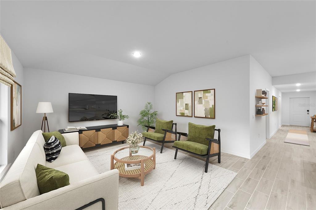 This is a digital rendering of a living room with a sofa, chairs, and television — 1428 PULASKI STREET, PORT CHARLOTTE, FL