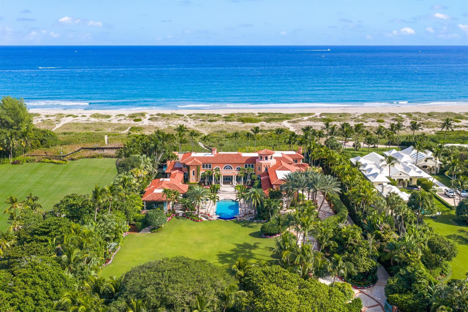 An aerial view of a large Mediterranean-style beachfront estate with a pool and lush landscaping — 1491 N Ocean Boulevard, Palm Beach FL 33480, PALM BEACH, FL