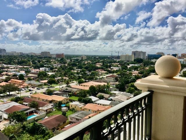 An elevated view from a balcony overlooking a suburban neighborhood under a cloudy sky — 3232 SW 22nd Ter # 1303, Miami FL 33145, MIAMI, FL