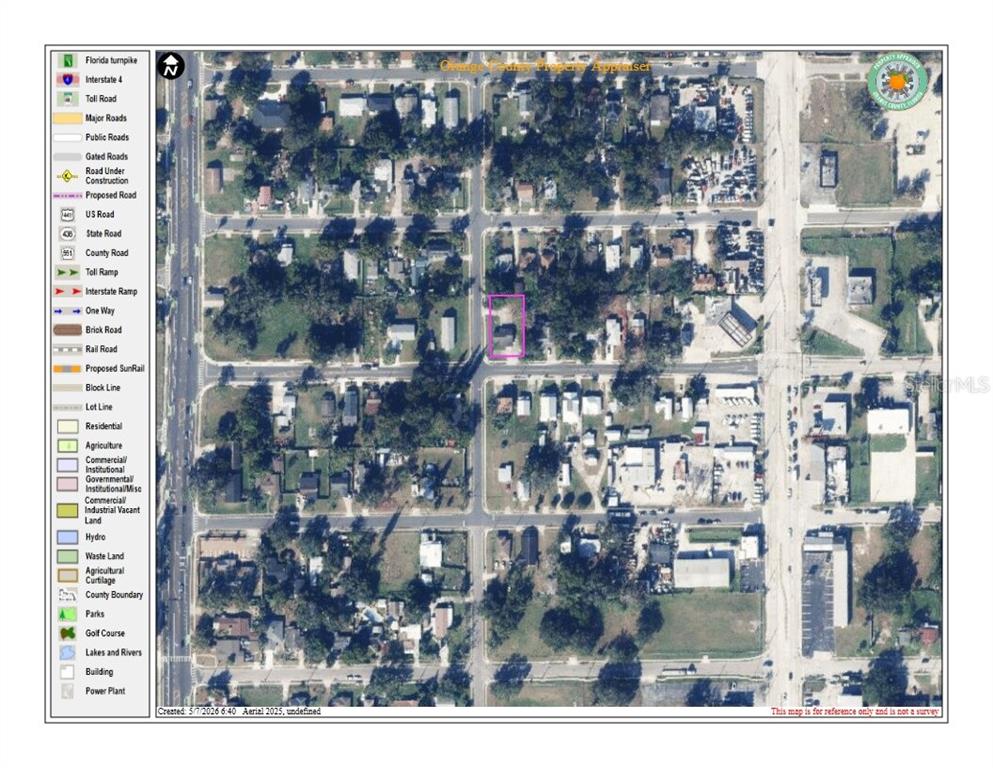 This is an aerial map showing a residential property lot highlighted in purple — 1345 W KALEY AVENUE, ORLANDO, FL