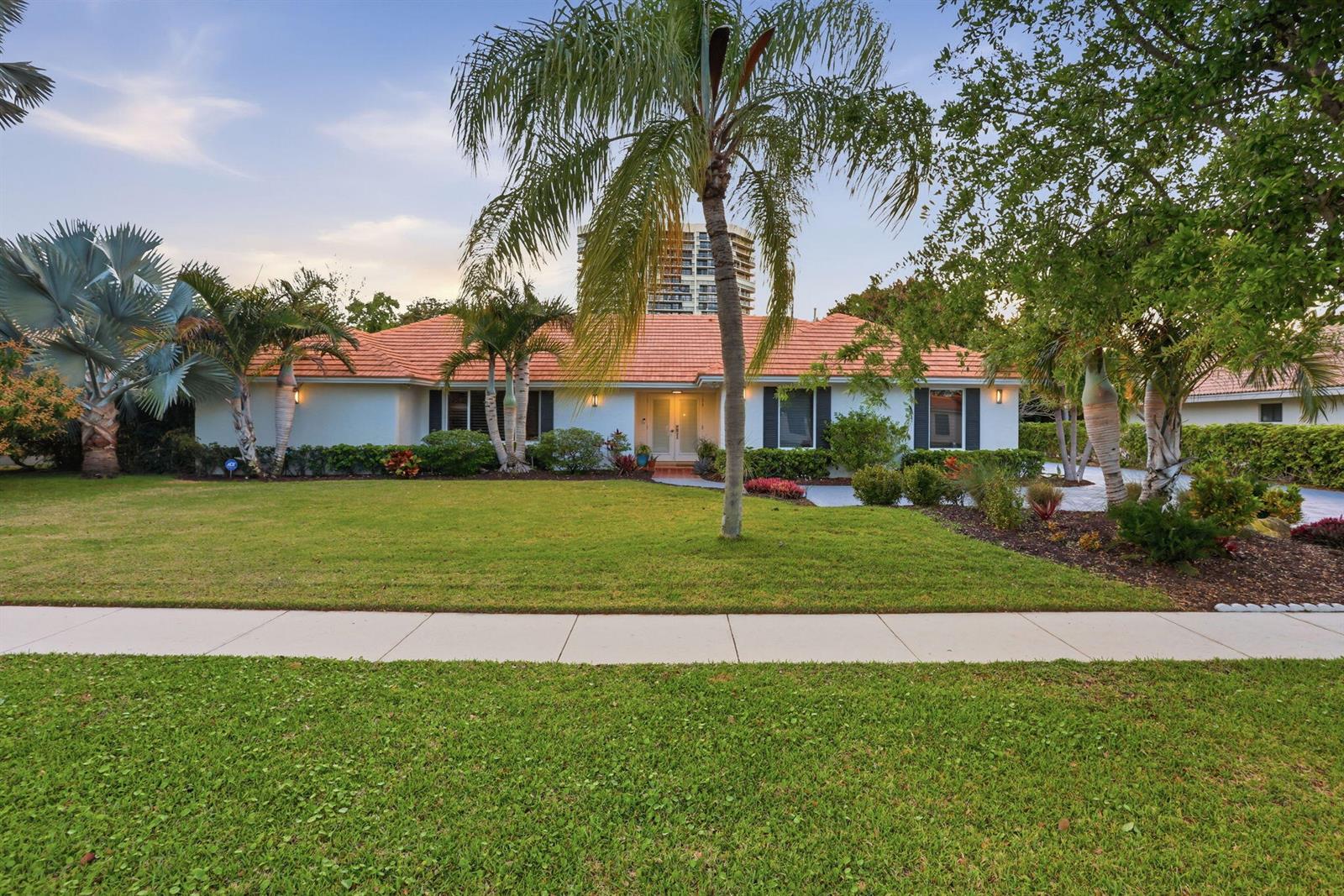 A single-story house with a terracotta tile roof and palm trees in the front yard — 2001 Embassy Drive, West Palm Beach FL 33401, WEST PALM BEACH, FL