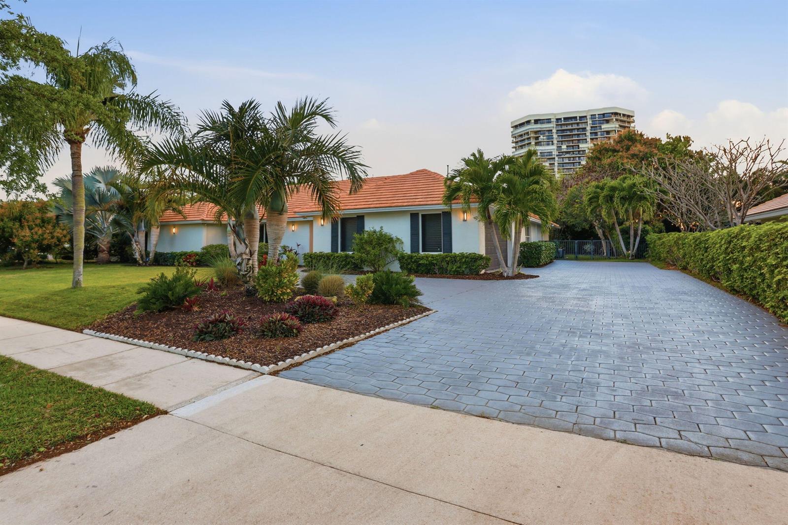 A single-story house with a tiled roof, palm trees, and a paved driveway — 2001 Embassy Drive, West Palm Beach FL 33401, WEST PALM BEACH, FL