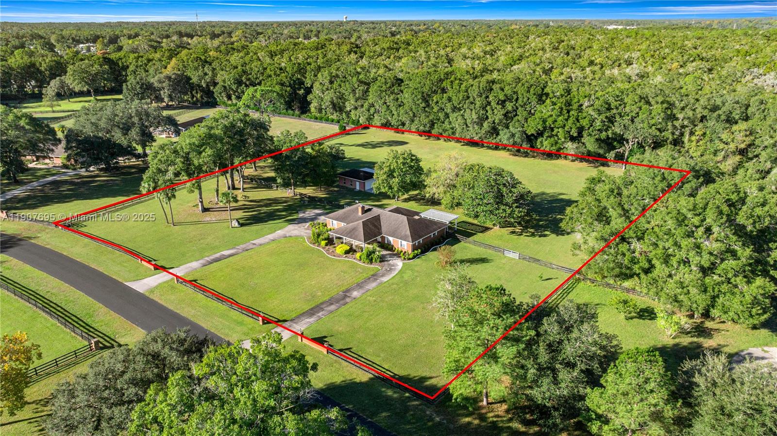 An aerial view shows a brick house and a detached garage on a large lot — 9812 SW 74 Ave, Ocala FL 34476, OCALA, FL