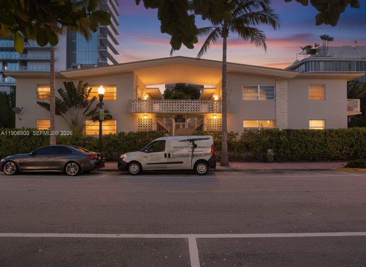 A two-story apartment building exterior at dusk with a van parked in front — 101 Collins Ave # 2, Miami Beach FL 33139, MIAMI BEACH, FL