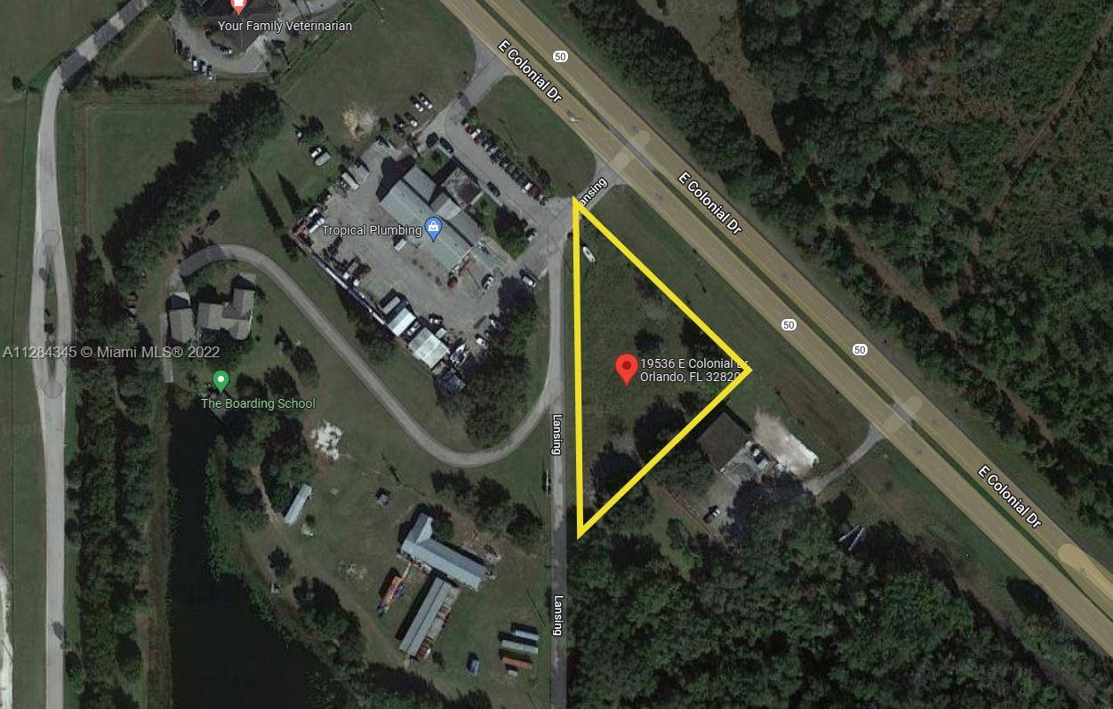 This is an aerial map view of a triangular vacant lot bordered by two roads — 19536 E Colonial Dr, Orlando FL 32820, ORLANDO, FL