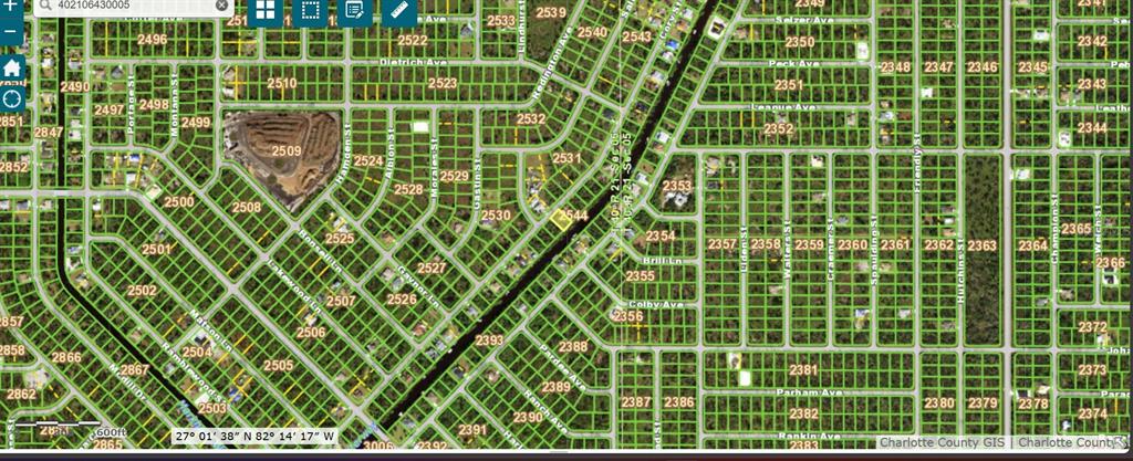 This is a satellite map showing a vacant residential lot highlighted in yellow near a waterway — 332 CORY STREET, PORT CHARLOTTE, FL