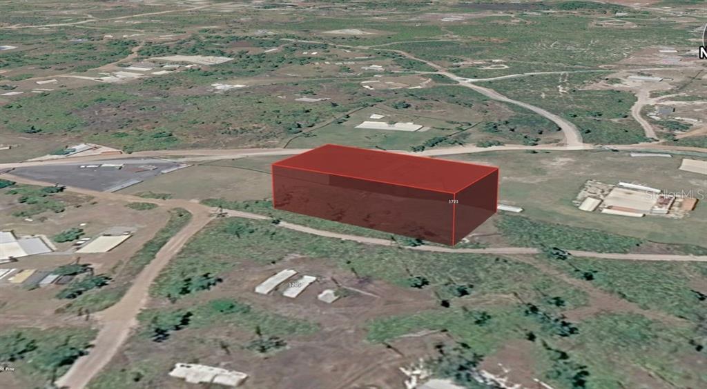 An aerial view shows a red-highlighted rectangular property lot in a rural, undeveloped area — UNNASSIGNED, FROSTPROOF, FL