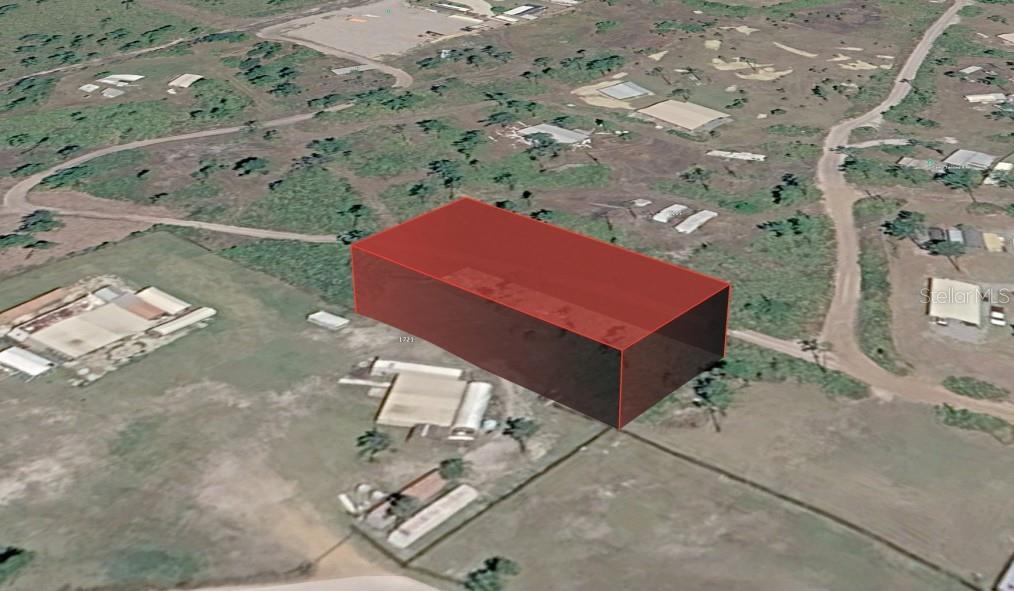 An aerial view shows a vacant lot highlighted in red within a rural landscape — UNNASSIGNED, FROSTPROOF, FL