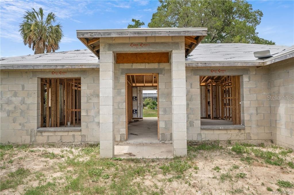 An unfinished concrete block house with an open entryway and exposed wooden wall framing — 4525 E REJOICE STREET, INVERNESS, FL