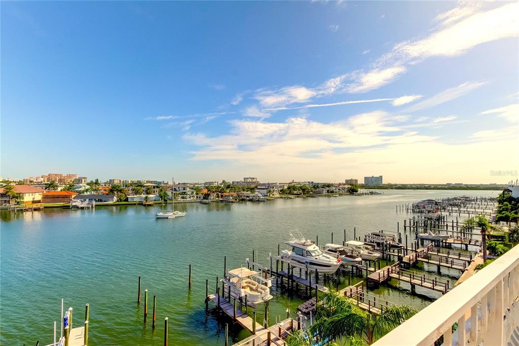 An elevated view of a marina with several boats docked in a calm waterway — 120 BRIGHTWATER DRIVE UNIT 5, CLEARWATER, FL
