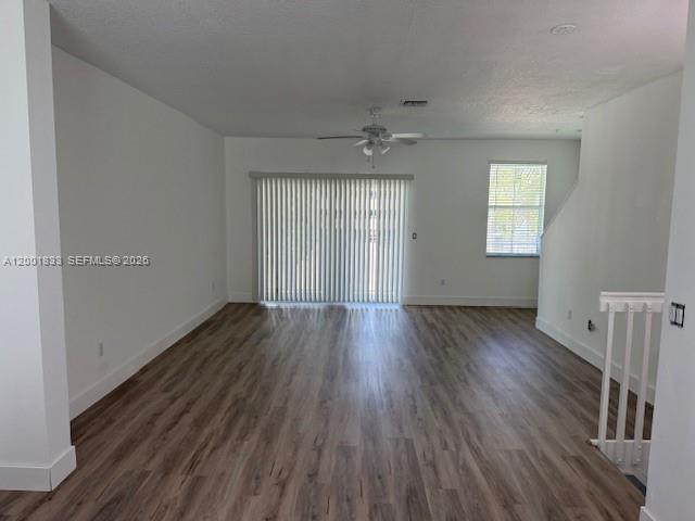 This living room features a sectional sofa, an armchair, a coffee table, and a television — BOYNTON BEACH, FL