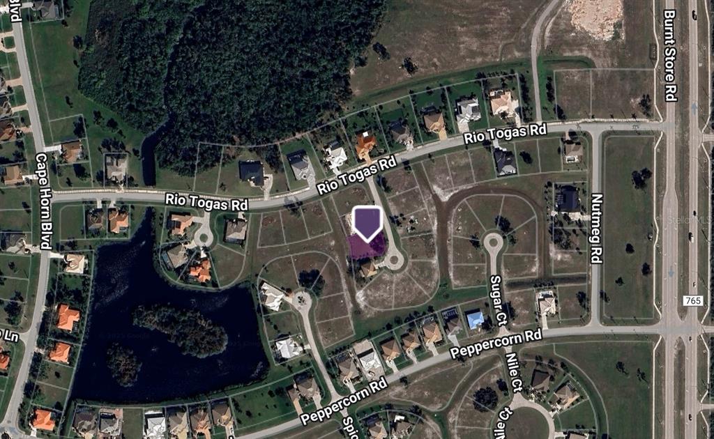 This is an aerial map view of a residential neighborhood with a highlighted property lot — 17151 PEBBLEWOOD LANE, PUNTA GORDA, FL