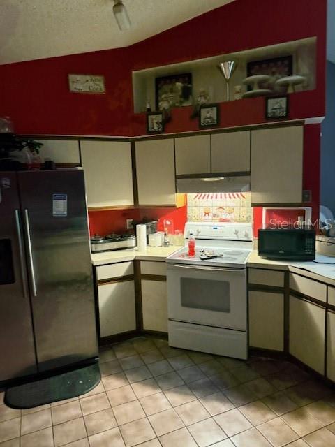 A kitchen features white cabinets, stainless steel appliances, and a red accent wall — 3424 ALISSA COURT, ORLANDO, FL