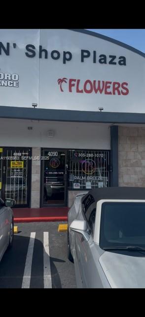 The exterior of a commercial storefront features a sign for Palm Breeze Flowers — 4090 NW 167th St, Miami FL 33054, MIAMI, FL