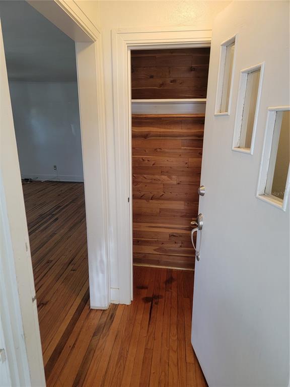 An open door reveals a small closet with cedar-lined walls and a single shelf — 3720 4TH AVENUE N, ST PETERSBURG, FL
