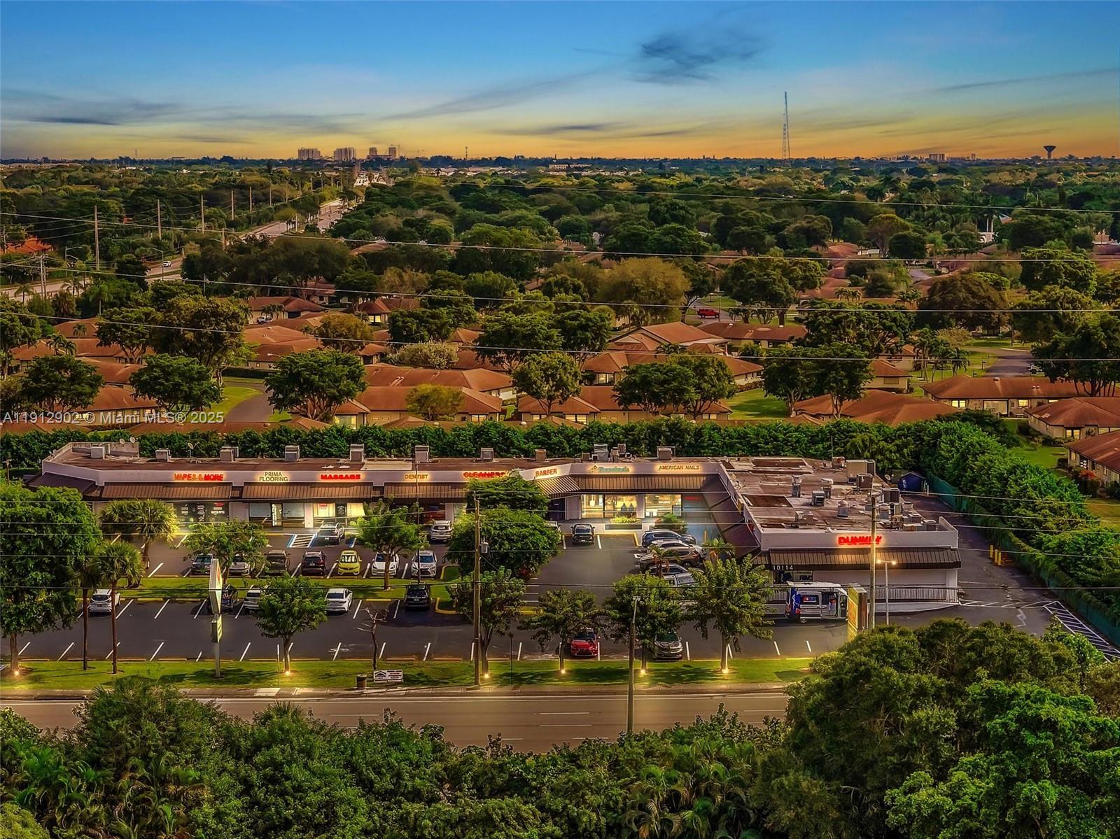 An aerial view shows a commercial strip mall with a parking lot and surrounding residential neighborhood — 10114 S Military Trl, Boynton Beach FL 33436, BOYNTON BEACH, FL