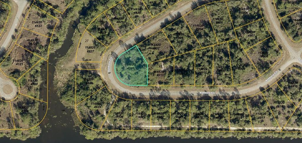 This is an aerial map showing a highlighted vacant residential lot on a curved street — 1148204901 ASHBORO CIRCLE, NORTH PORT, FL