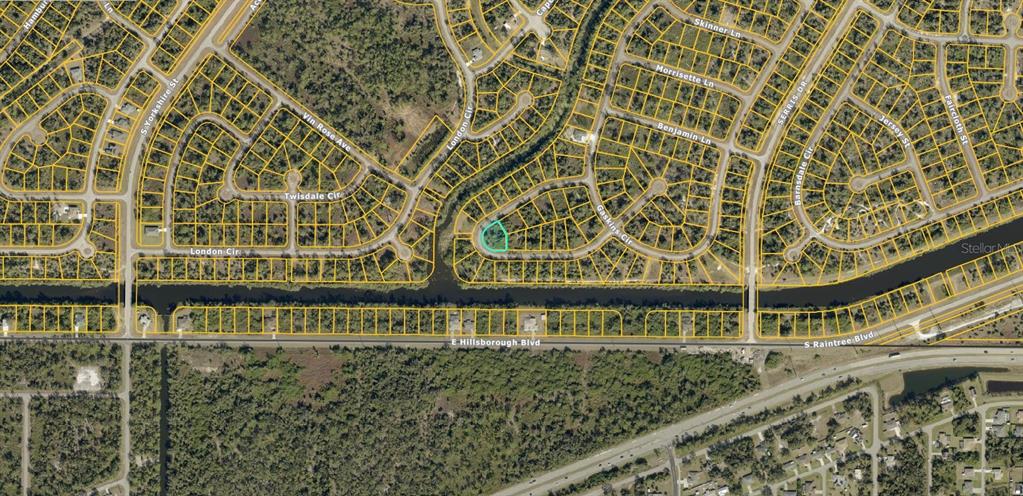 This is an aerial map showing a highlighted residential lot within a suburban neighborhood — 1148204901 ASHBORO CIRCLE, NORTH PORT, FL