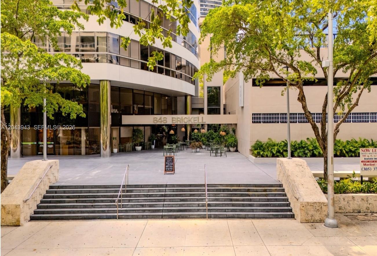 A wide staircase leads to the entrance of a modern office building with outdoor seating — 848 NE Brickell Avenue, Miami FL 33131, MIAMI, FL