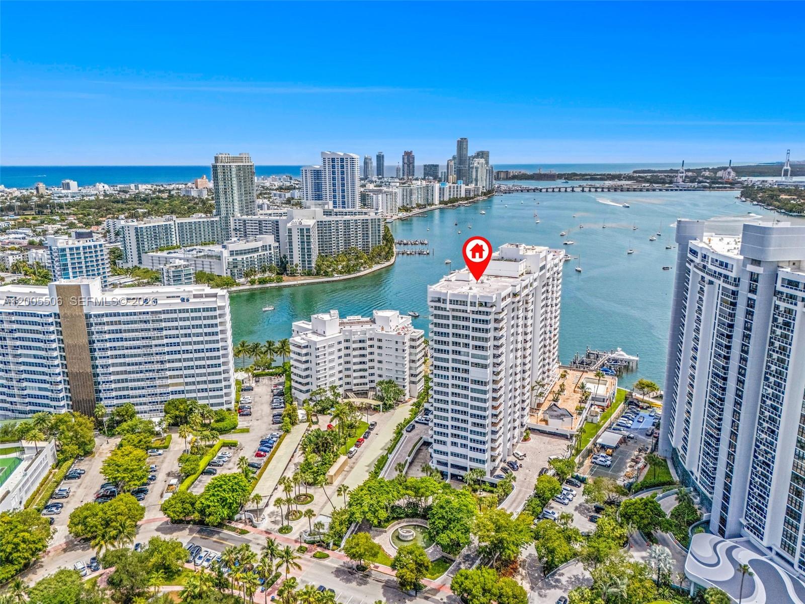 An aerial view shows a high-rise apartment building marked with a red location pin — 11 Island Ave # 411, Miami Beach FL 33139, MIAMI BEACH, FL
