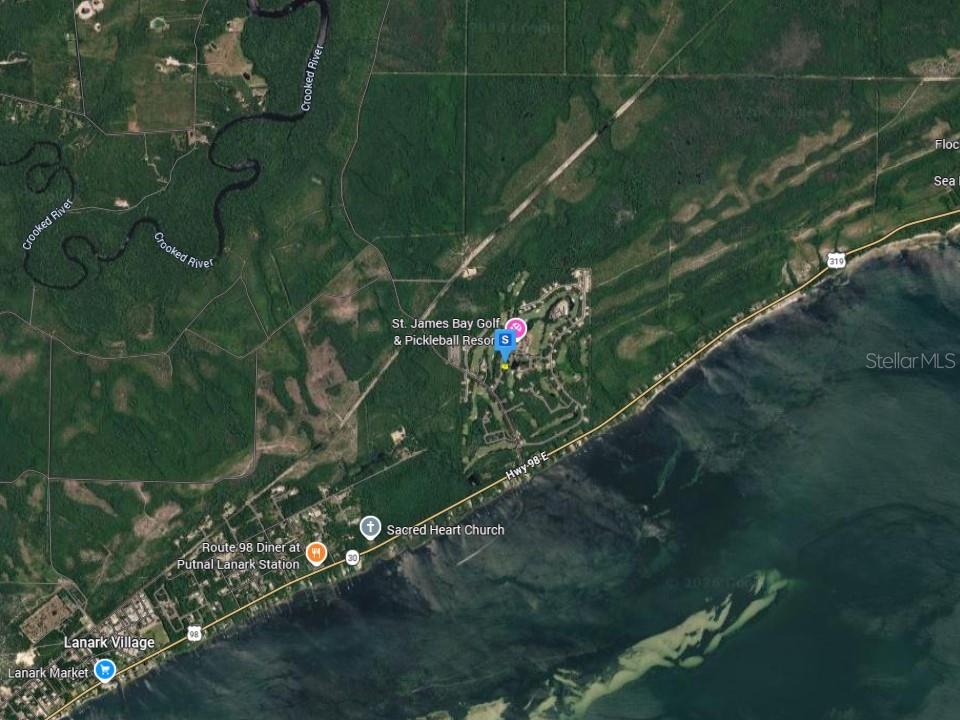 This is a satellite map showing St. James Bay Golf & Pickleball Resort and surroundings — 126 LAUGHING GULL LANE, CARRABELLE, FL