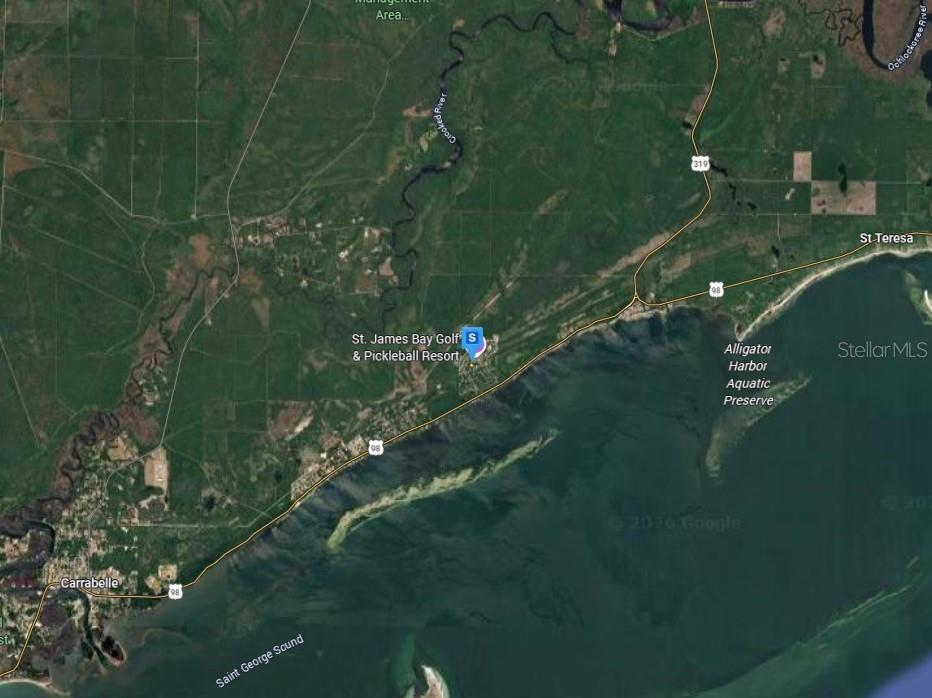 This is a satellite map view showing the St. James Bay Golf & Pickleball Resort — 126 LAUGHING GULL LANE, CARRABELLE, FL