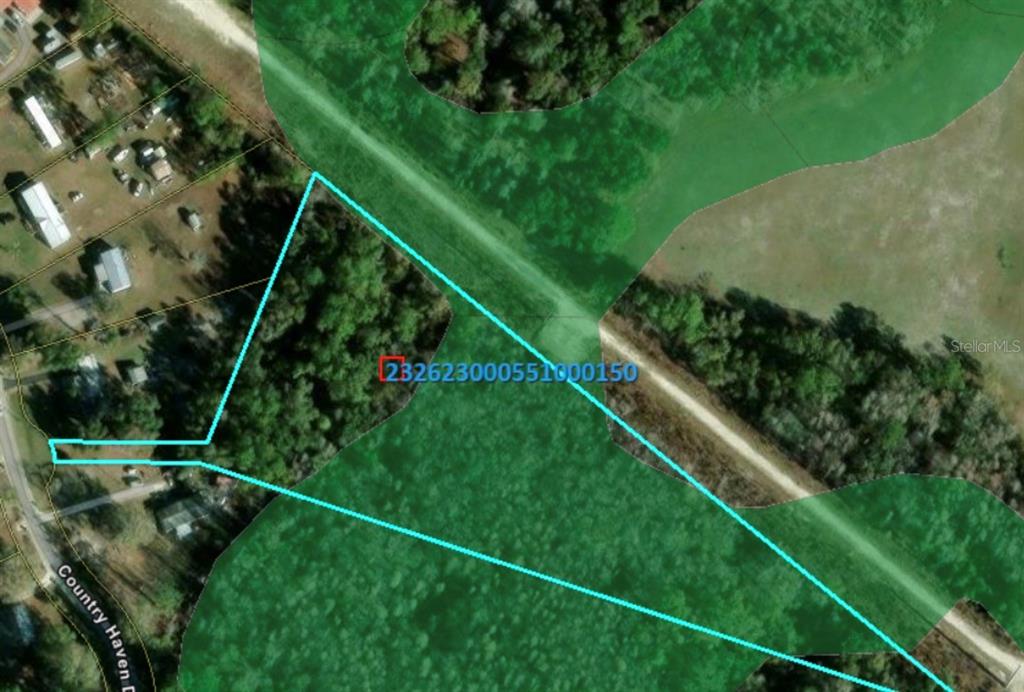 An aerial map shows a property parcel outlined in blue against a wooded landscape — 0 COUNTRY HAVEN DRIVE, LAKELAND, FL