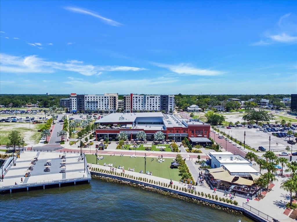 An aerial view of the Tampa Armature Works building, surrounding parking lots, and waterfront promenade — 1819 E 5TH AVENUE, TAMPA, FL