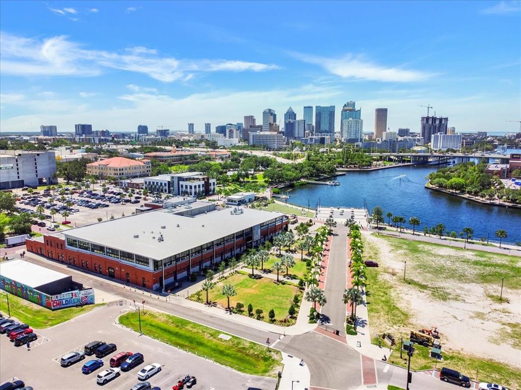 An aerial view of a large building, a river, and the Tampa city skyline — 1819 E 5TH AVENUE, TAMPA, FL