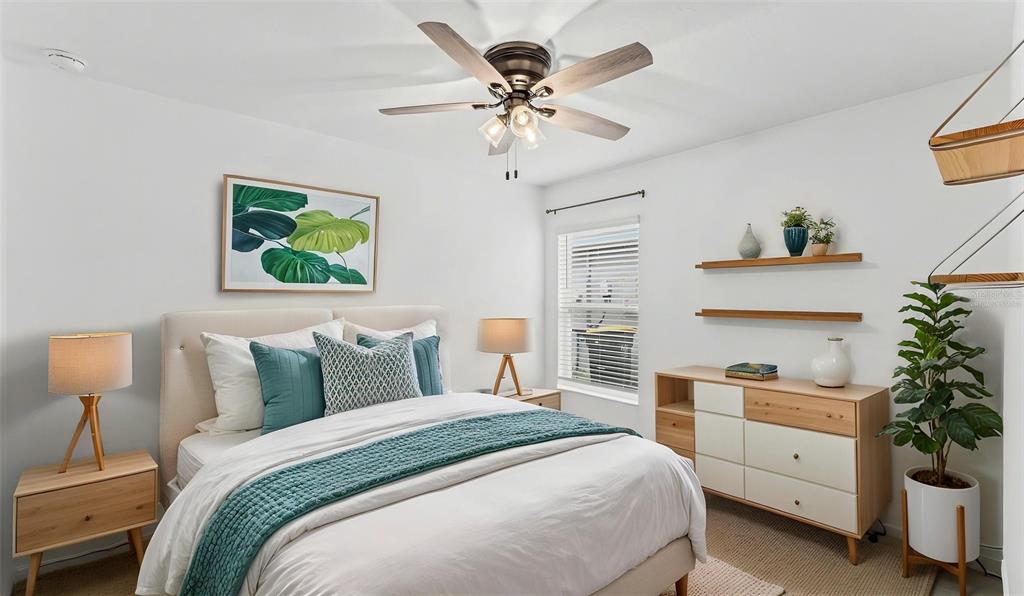 A bedroom features a queen bed, a dresser, two nightstands, and a ceiling fan — 272 PERSHING STREET, BARTOW, FL