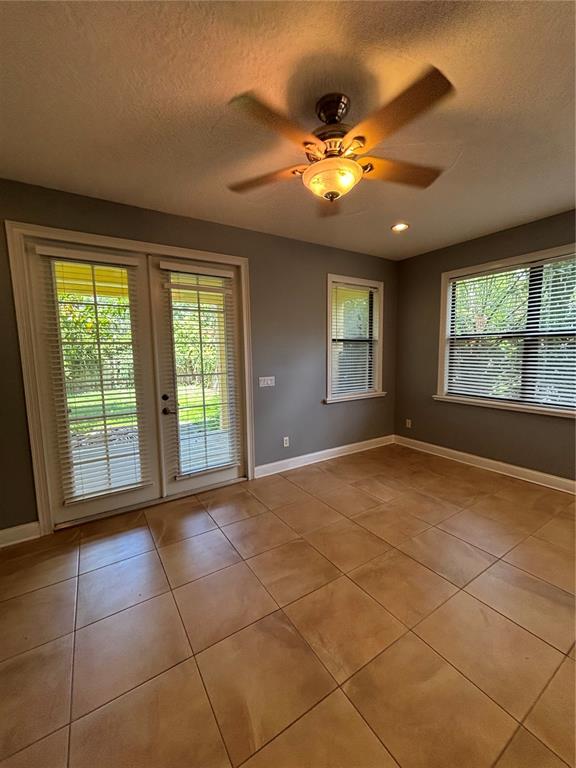 A room with tile flooring, a ceiling fan, French doors, and windows with blinds — 2505 KILGORE STREET, ORLANDO, FL