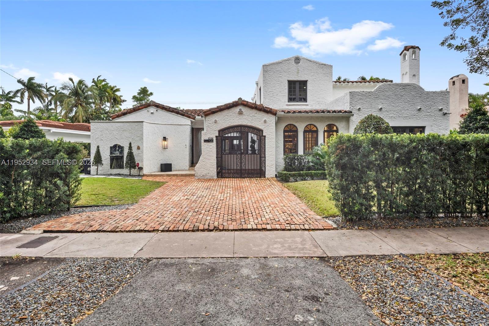 A white stucco house with a red tile roof and a brick driveway — 1236 Obispo Ave, Coral Gables FL 33134, CORAL GABLES, FL