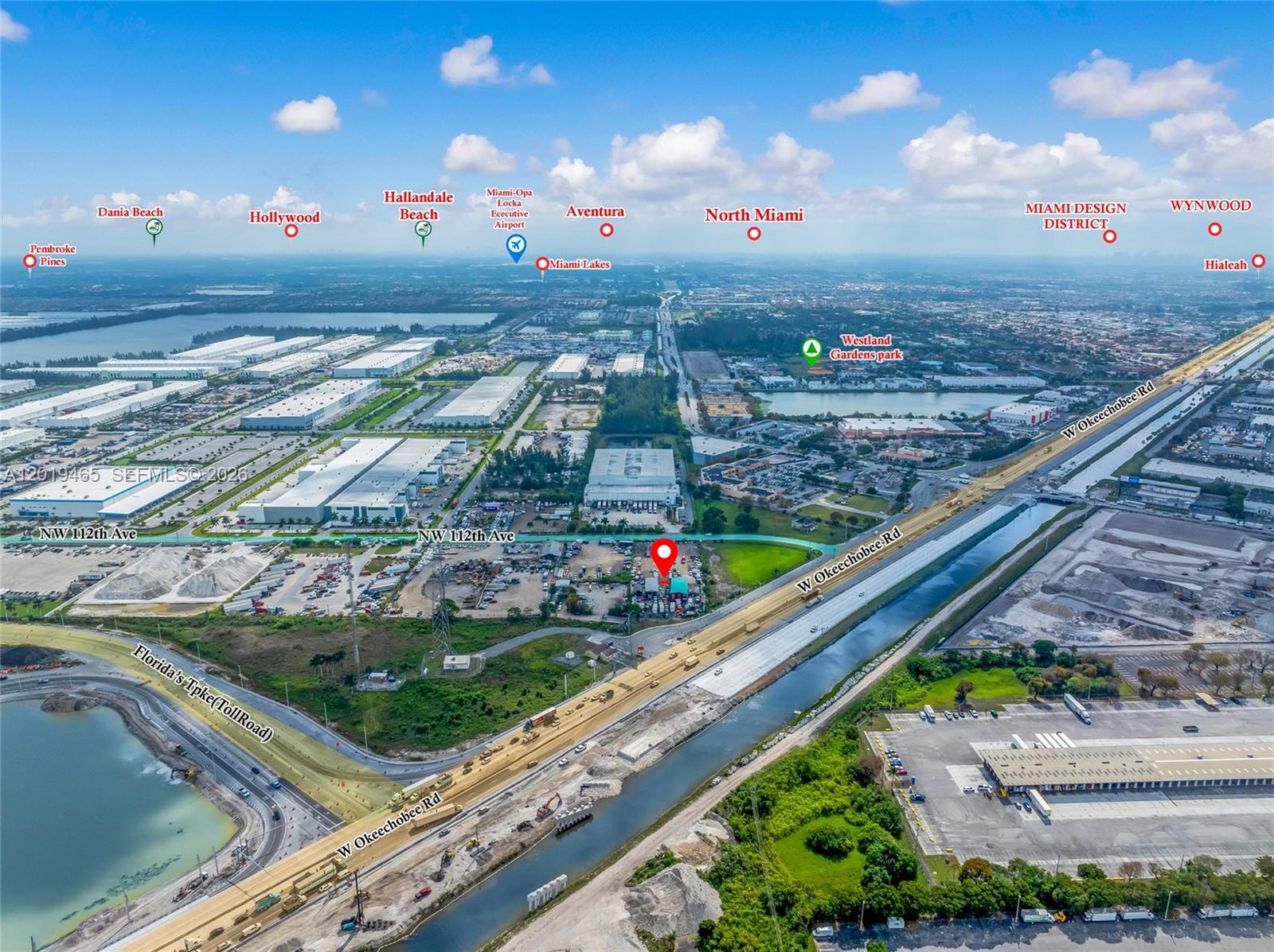 This is an aerial map view of a commercial property near a highway and canal — 13800 NW 112th Ave, Hialeah Gardens FL 33018, HIALEAH GARDENS, FL