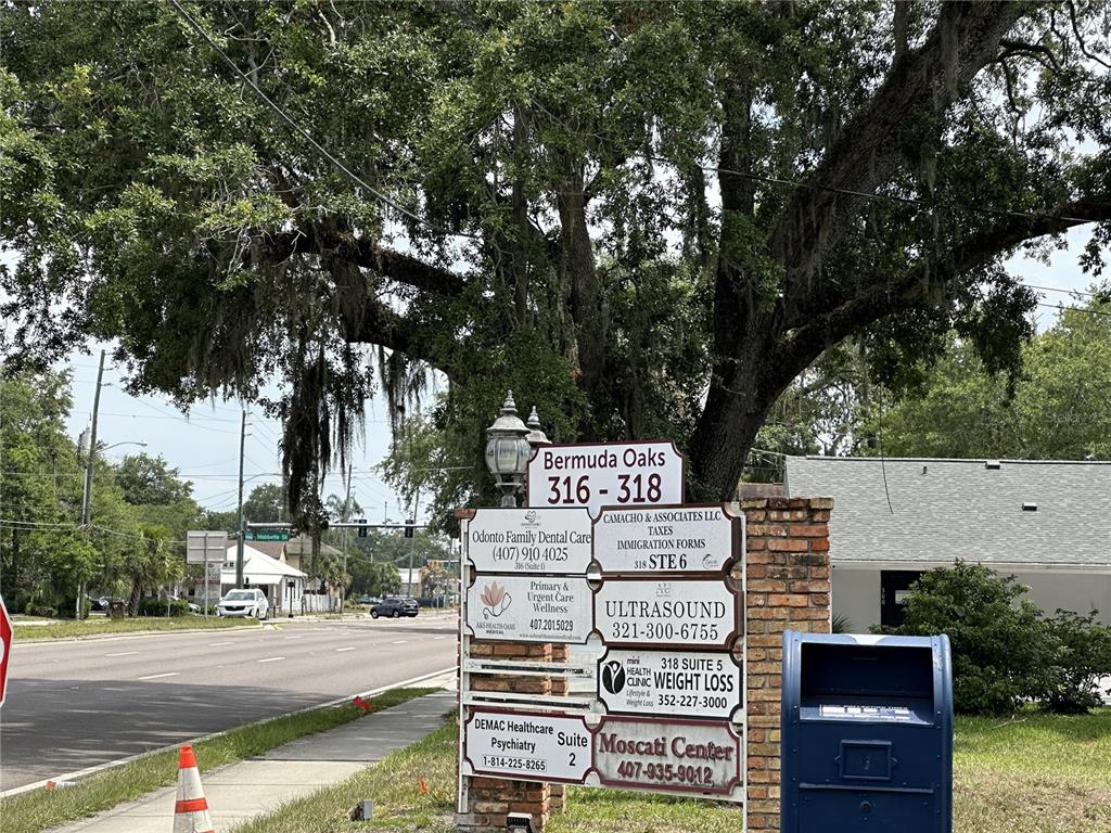 A sign for Bermuda Oaks lists various medical and professional offices near a roadside — 318 N JOHN YOUNG PARKWAY UNIT 101, KISSIMMEE, FL
