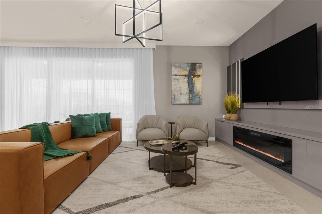 A modern living room features a tan sofa, two armchairs, a fireplace, and a television — 3048 MAHALO DRIVE, DAVENPORT, FL
