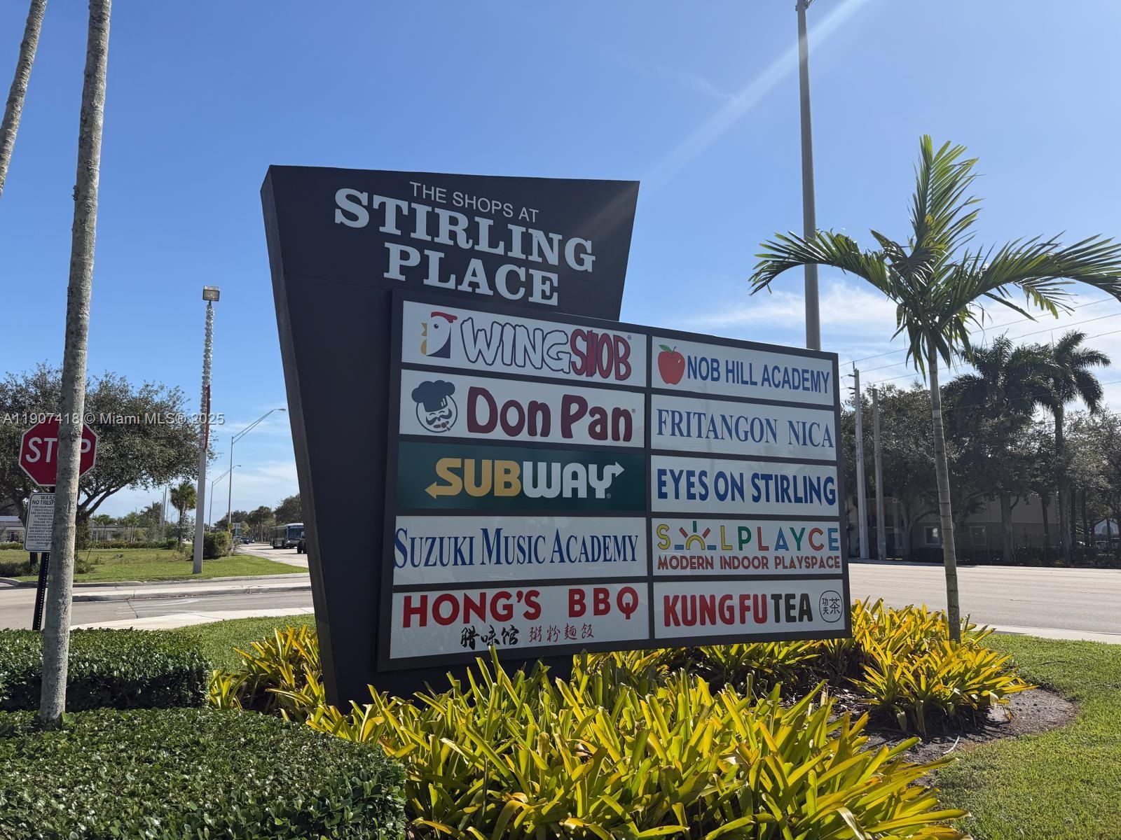 A sign for The Shops at Stirling Place lists various businesses on a sunny day — 6827 Stirling, Davie FL 33314, DAVIE, FL