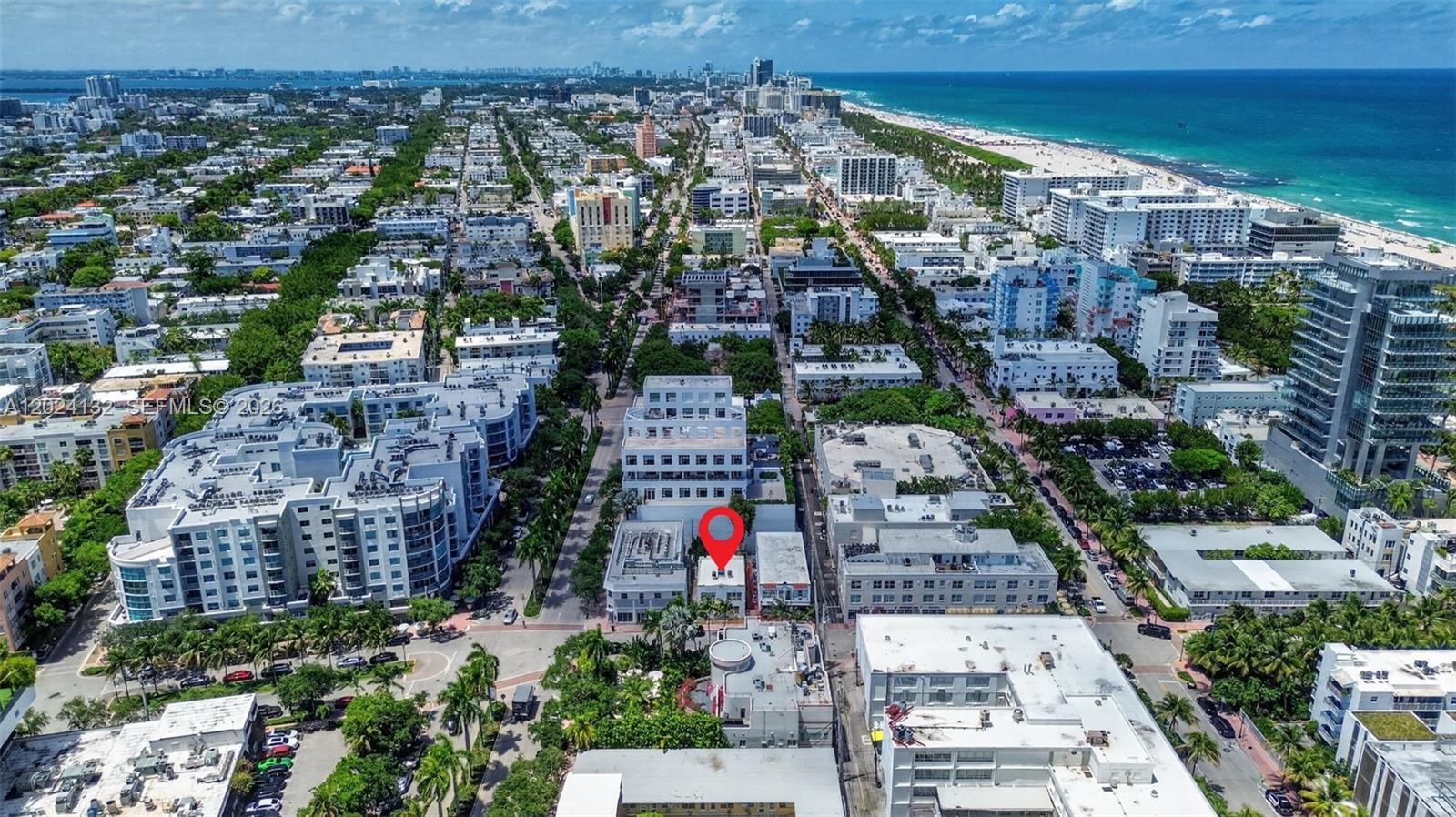 An aerial view shows a city neighborhood with a red pin marking a specific building — 233 1st St, Miami Beach FL 33139, MIAMI BEACH, FL