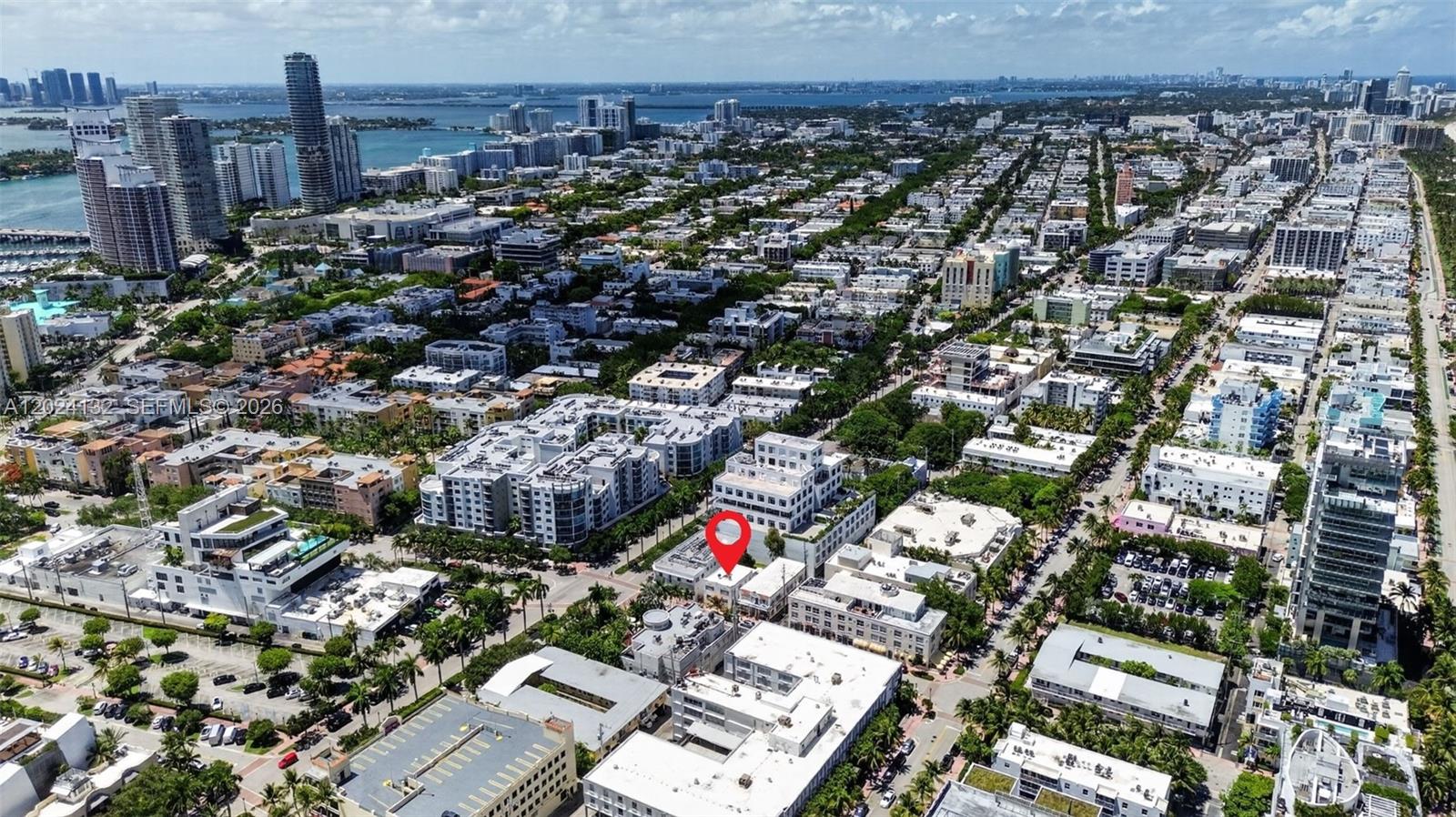 An aerial view shows a red location pin over a low-rise building in Miami — 233 1st St, Miami Beach FL 33139, MIAMI BEACH, FL