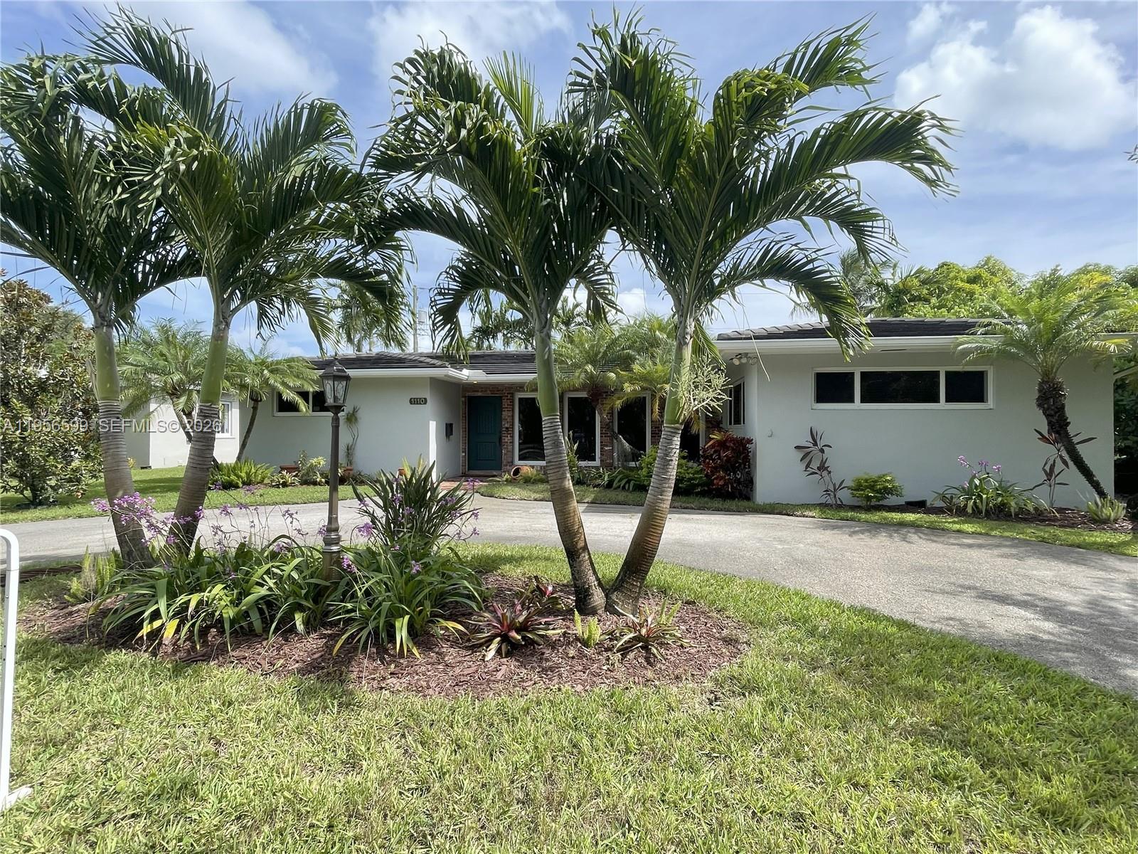 A single-story house with a circular driveway and palm trees in the front yard — 1110 Redbird Ave, Miami Springs FL 33166, MIAMI SPRINGS, FL