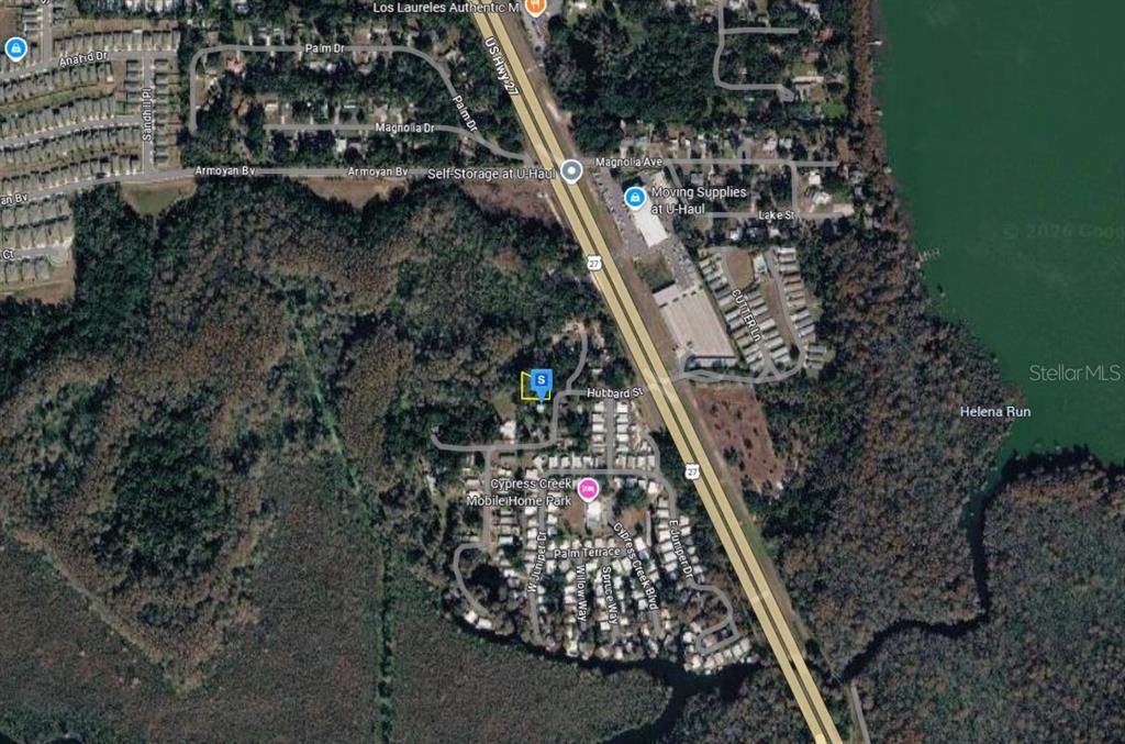 An aerial map view showing a residential area near a highway and a lake — 28915 HUBBARD STREET, LEESBURG, FL