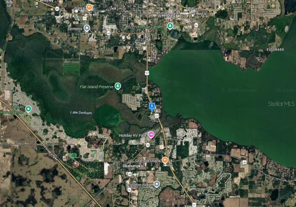This is a satellite map view of the Leesburg, Florida area near Lake Harris — 28915 HUBBARD STREET, LEESBURG, FL
