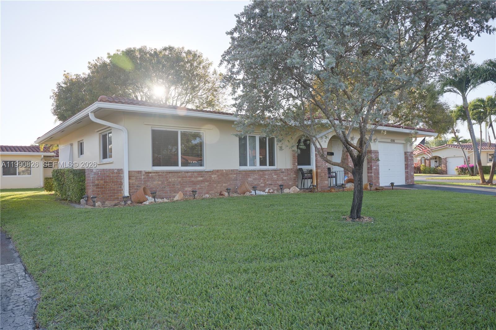 A single-story house with a brick facade, a tiled roof, and a front lawn — 4391 NW 12th Ter, Deerfield Beach FL 33064, DEERFIELD BEACH, FL
