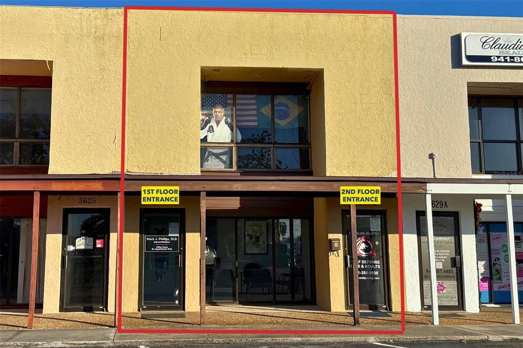 A two-story commercial building exterior features a ground-level storefront and an upper-level window display — 3627 WEBBER STREET, SARASOTA, FL